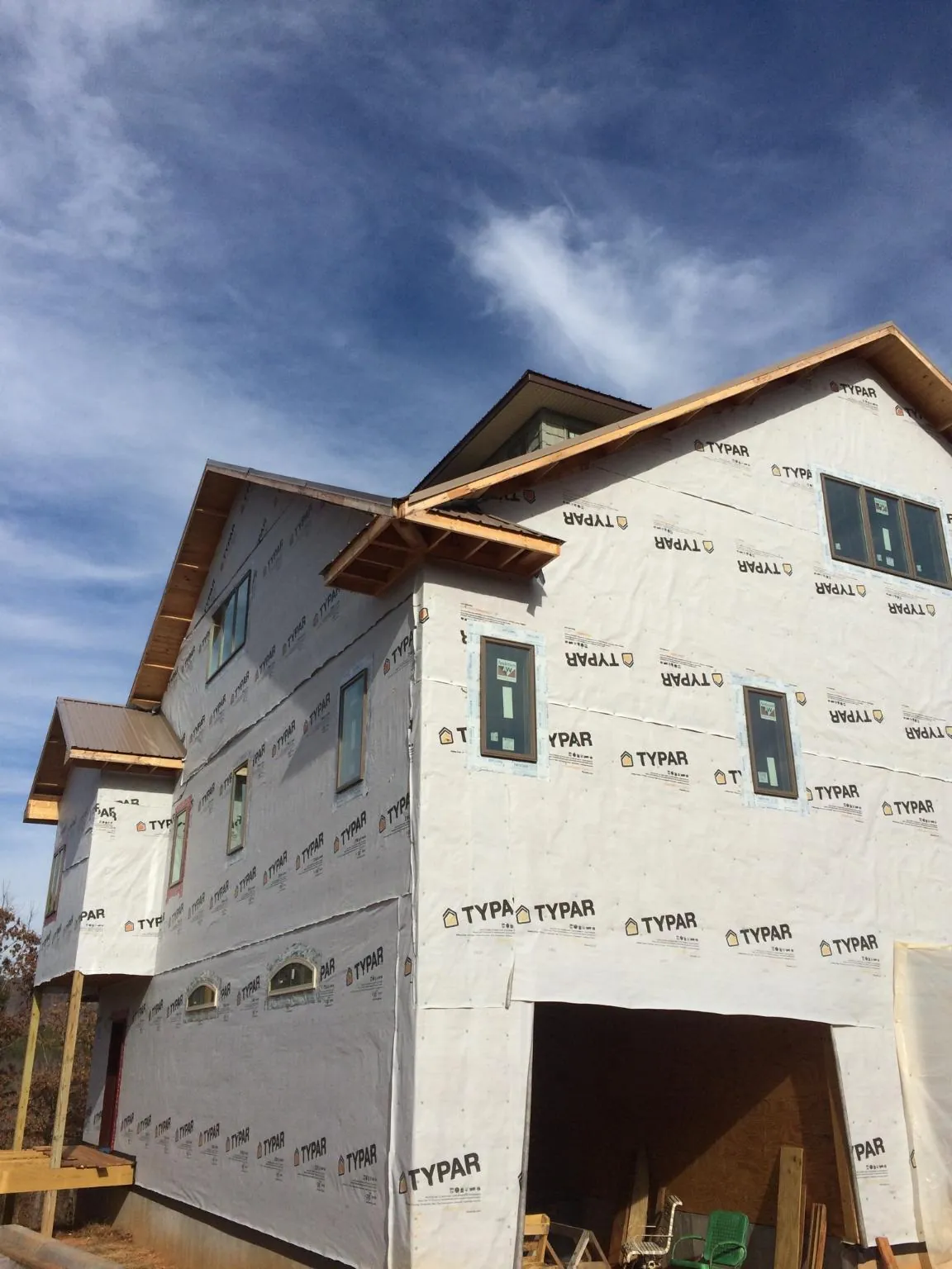 Stick built house wrapped in Typar with new roof framing and dormers in Lynbrook